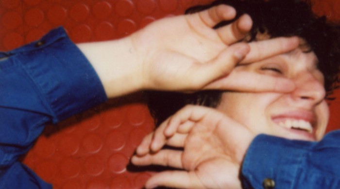 Marti Perramon with his hands over the side of his face