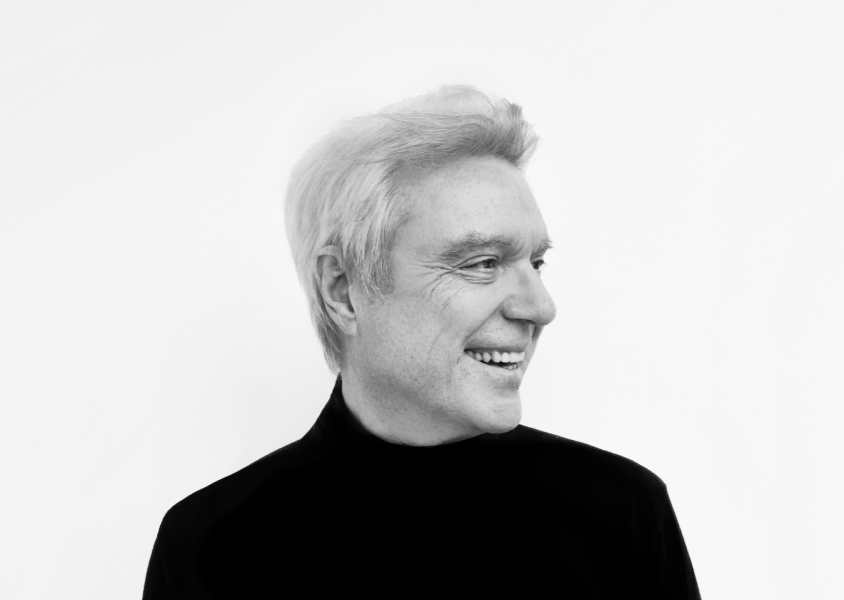David Byrne smiling and looking into the distancex