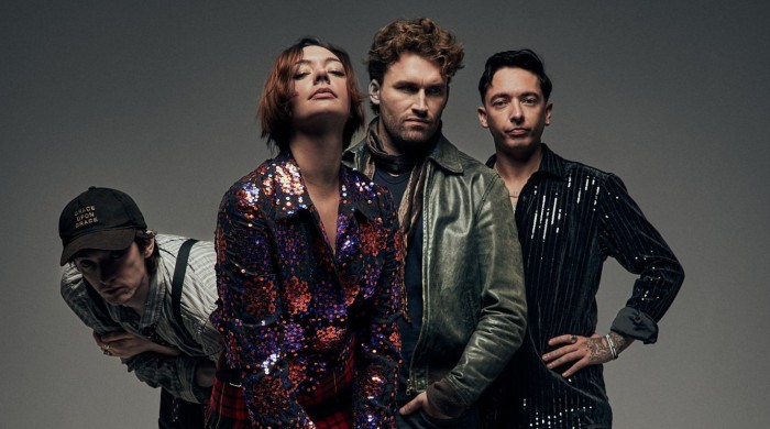 band posing against grey background