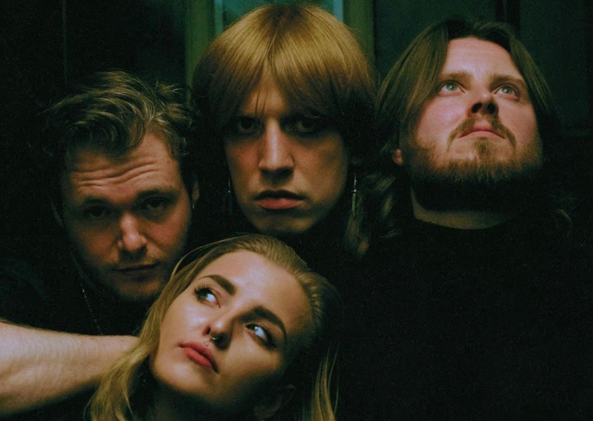 Mercy Girl members, Daisy Miles, Davey Purdie, Craig Harkness and Kyle MacNaughton looking into the distance.x