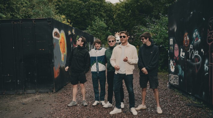 5 men posing outdoors
