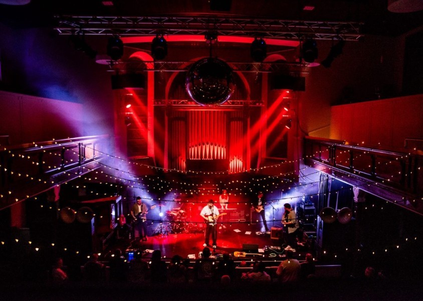 The Painting performing on stage.x
